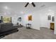 Open living room showcasing wood-look tile floors, neutral paint, and an abundance of natural light at 1208 Old Apopka Rd, Apopka, FL 32703