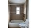 Cozy bathroom features a combined tub and shower with new tile at 1320 S Oleander Ave, Sanford, FL 32771