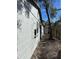Exterior side view featuring light colored brick and a fenced yard at 1320 S Oleander Ave, Sanford, FL 32771