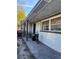 Long grey brick house with a porch and a red truck parked in front with a blue sky at 1320 S Oleander Ave, Sanford, FL 32771