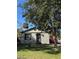 Brick home with a landscaped yard and a covered porch at 1320 S Oleander Ave, Sanford, FL 32771