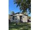 Charming one-story home with a brick exterior and a well-maintained front yard under a blue sky at 1320 S Oleander Ave, Sanford, FL 32771
