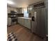 A beautiful kitchen with a stainless steel refrigerator and updated cabinets at 1320 S Oleander Ave, Sanford, FL 32771
