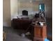 Living room with a fireplace and hardwood floors, partially furnished at 1320 S Oleander Ave, Sanford, FL 32771