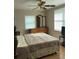 Bedroom with wood floors, windows, dresser, and ceiling fan at 1320 S Oleander Ave, Sanford, FL 32771