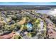 Aerial view of community, showing homes, streets, and lake at 1918 Arden Oaks Dr, Ocoee, FL 34761
