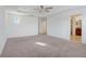 Bright bedroom featuring carpet, ceiling fan and ensuite bathroom at 1918 Arden Oaks Dr, Ocoee, FL 34761
