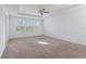 Spacious bedroom with carpeted floor and three windows at 1918 Arden Oaks Dr, Ocoee, FL 34761