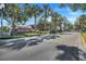 Arden Park community entrance with palm trees and a brick-paved road at 1918 Arden Oaks Dr, Ocoee, FL 34761
