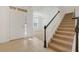 Inviting entryway with tiled floors and staircase leading upstairs at 1918 Arden Oaks Dr, Ocoee, FL 34761