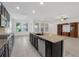 Open kitchen with island, granite countertops and stainless steel appliances at 1918 Arden Oaks Dr, Ocoee, FL 34761