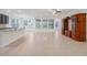 Spacious living room with tile floors and built-in shelving at 1918 Arden Oaks Dr, Ocoee, FL 34761
