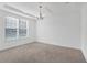 Empty spare bedroom with new carpet and large window at 1918 Arden Oaks Dr, Ocoee, FL 34761