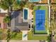 Stunning aerial view showcasing the home, pool, tennis court, and landscaped yard at 2337 Worthington Rd, Maitland, FL 32751