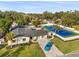 Beautiful single-story home with a pool, a private tennis court, and a long paver driveway at 2337 Worthington Rd, Maitland, FL 32751