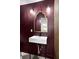 Modern bathroom features a sleek sink, gold mirror, and stylish light fixtures at 2337 Worthington Rd, Maitland, FL 32751