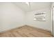 A bedroom featuring hardwood floors, a ceiling fan, and a window at 2337 Worthington Rd, Maitland, FL 32751