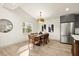 Dining room featuring a wooden table, modern decor, and natural light at 2337 Worthington Rd, Maitland, FL 32751