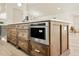 Kitchen island featuring stainless steel appliances and quartz countertops at 2337 Worthington Rd, Maitland, FL 32751