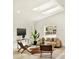 Cozy living room with comfortable seating, skylights, and modern decor at 2337 Worthington Rd, Maitland, FL 32751