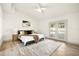 Bright main bedroom features french doors, ceiling fan and hardwood floors at 2337 Worthington Rd, Maitland, FL 32751