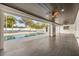 Covered patio overlooks the pool, tennis court, and backyard areas at 2337 Worthington Rd, Maitland, FL 32751