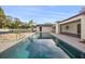 Backyard pool is showcased with a tiled edge, and the tennis court can be seen in the background at 2337 Worthington Rd, Maitland, FL 32751