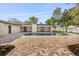 Backyard pool with colorful brick pavers and access to the house on a sunny day at 2337 Worthington Rd, Maitland, FL 32751