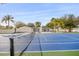 A private tennis court is a stunning addition to this renovated modern home at 2337 Worthington Rd, Maitland, FL 32751