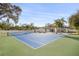 Wide shot of a full-sized tennis court and house with a pool at 2337 Worthington Rd, Maitland, FL 32751