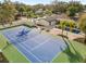 Aerial view features a tennis court, pool, and manicured grounds of the modern home at 2337 Worthington Rd, Maitland, FL 32751