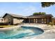 A gorgeous backyard with a lovely pool, patio, and lots of space for outdoor entertaining at 2631 Falmouth Rd, Maitland, FL 32751
