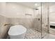 Luxurious bathroom with a standalone tub, walk-in shower, and designer tile at 2631 Falmouth Rd, Maitland, FL 32751