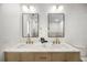 Double vanity bathroom with marble countertops and updated lighting at 2631 Falmouth Rd, Maitland, FL 32751