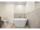 Stunning bathroom features a freestanding tub, modern fixtures, and stylish tiling at 2631 Falmouth Rd, Maitland, FL 32751
