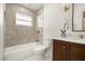 Beautiful bathroom with a shower-tub combination and a wooden vanity with a marble countertop at 2631 Falmouth Rd, Maitland, FL 32751