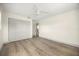 Bedroom with hardwood floors, a ceiling fan, and a closet and door in view at 2631 Falmouth Rd, Maitland, FL 32751