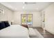 A bright and airy bedroom with glass doors leading to the patio and pool at 2631 Falmouth Rd, Maitland, FL 32751