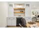 Close up of bar area with wine fridge, floating shelves, and cabinets at 2631 Falmouth Rd, Maitland, FL 32751