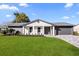 Charming single-story home featuring fresh landscaping and a modern two-car garage at 2631 Falmouth Rd, Maitland, FL 32751