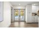 Bright kitchen and doorway view to the pool/lanai creates a seamless indoor-outdoor living at 2631 Falmouth Rd, Maitland, FL 32751