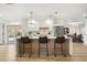 Bright, modern kitchen featuring a stylish island with seating, pendant lighting, and stainless steel appliances at 2631 Falmouth Rd, Maitland, FL 32751