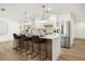 Modern kitchen with a large center island providing seating and stainless steel appliances at 2631 Falmouth Rd, Maitland, FL 32751
