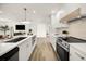 Modern kitchen featuring an island with bar seating, stainless steel appliances and open floorplan at 2631 Falmouth Rd, Maitland, FL 32751