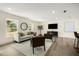 Welcoming living room featuring neutral tones, modern entertainment center, and a decorative house plant at 2631 Falmouth Rd, Maitland, FL 32751