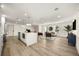 Bright, open-concept living space with modern island kitchen and living room with natural light at 2631 Falmouth Rd, Maitland, FL 32751