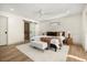 Main bedroom with a king-size bed, ensuite bathroom, and sliding barn door at 2631 Falmouth Rd, Maitland, FL 32751