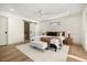 Bright main bedroom suite boasts ample natural light and ensuite bath with barn door at 2631 Falmouth Rd, Maitland, FL 32751