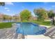 Backyard view of a beautiful inground pool overlooking a serene lake at 2631 Falmouth Rd, Maitland, FL 32751