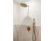 The shower has a rainfall shower head and updated brass fixtures at 2631 Falmouth Rd, Maitland, FL 32751